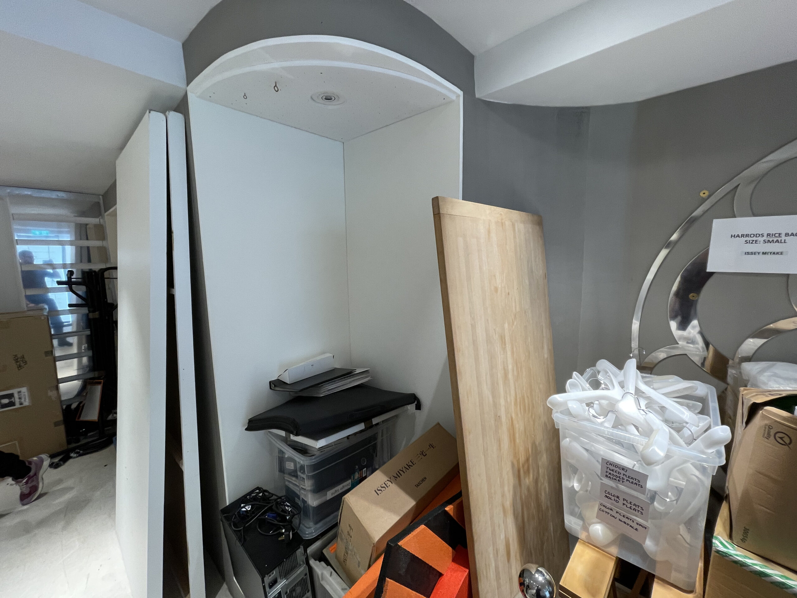 A back of house room at the Mallet unit before the fit out, stacked with boxes and equipment