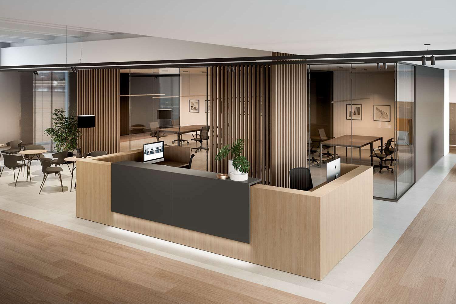 A reception desk in pale timber in front of a slatted screen, with glazed offices behind