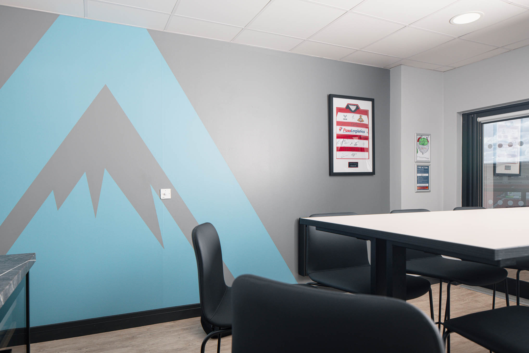 Colour-drenched interior of the refurbished executive box