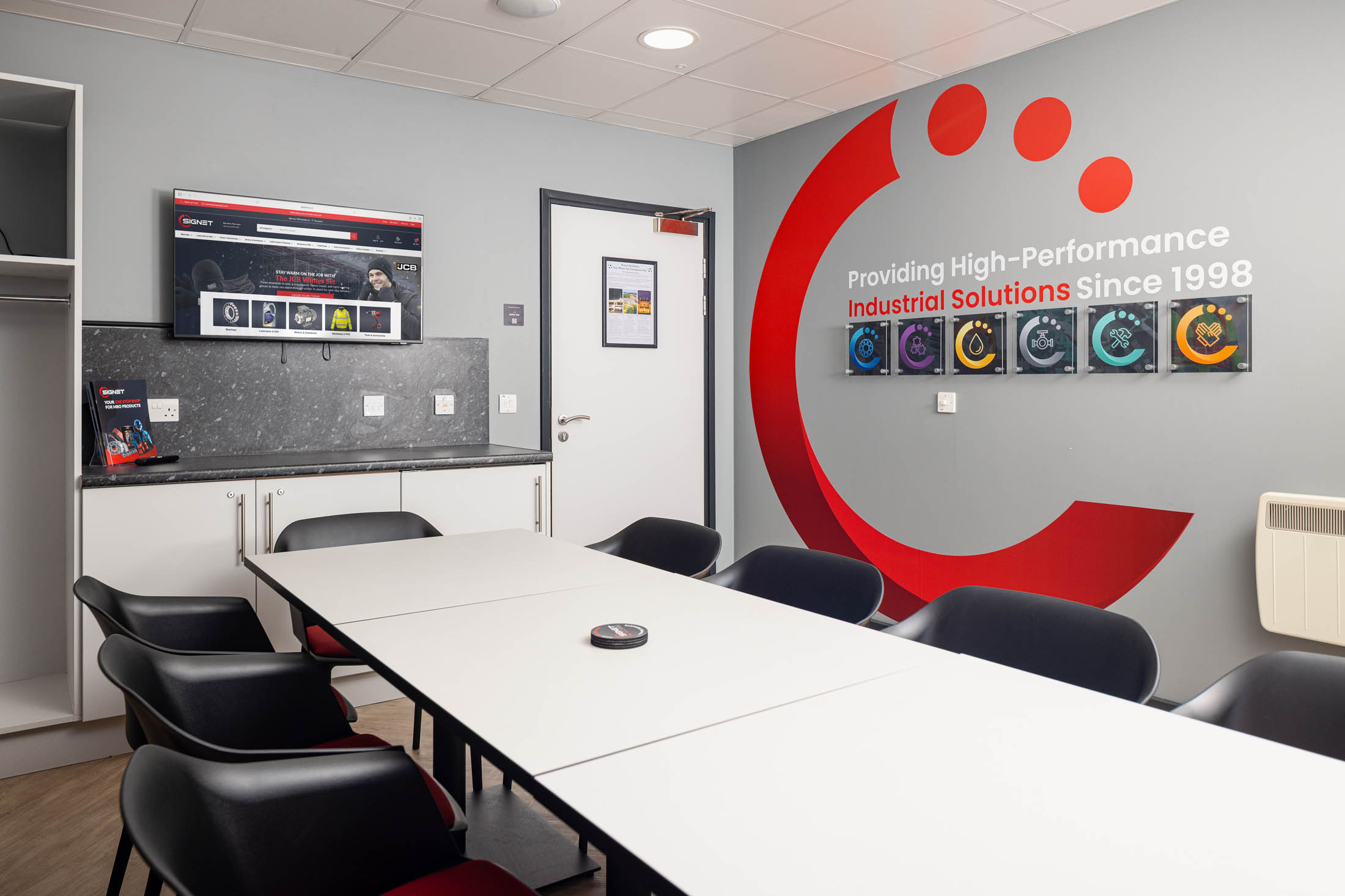Colour-drenched interior of the refurbished executive box