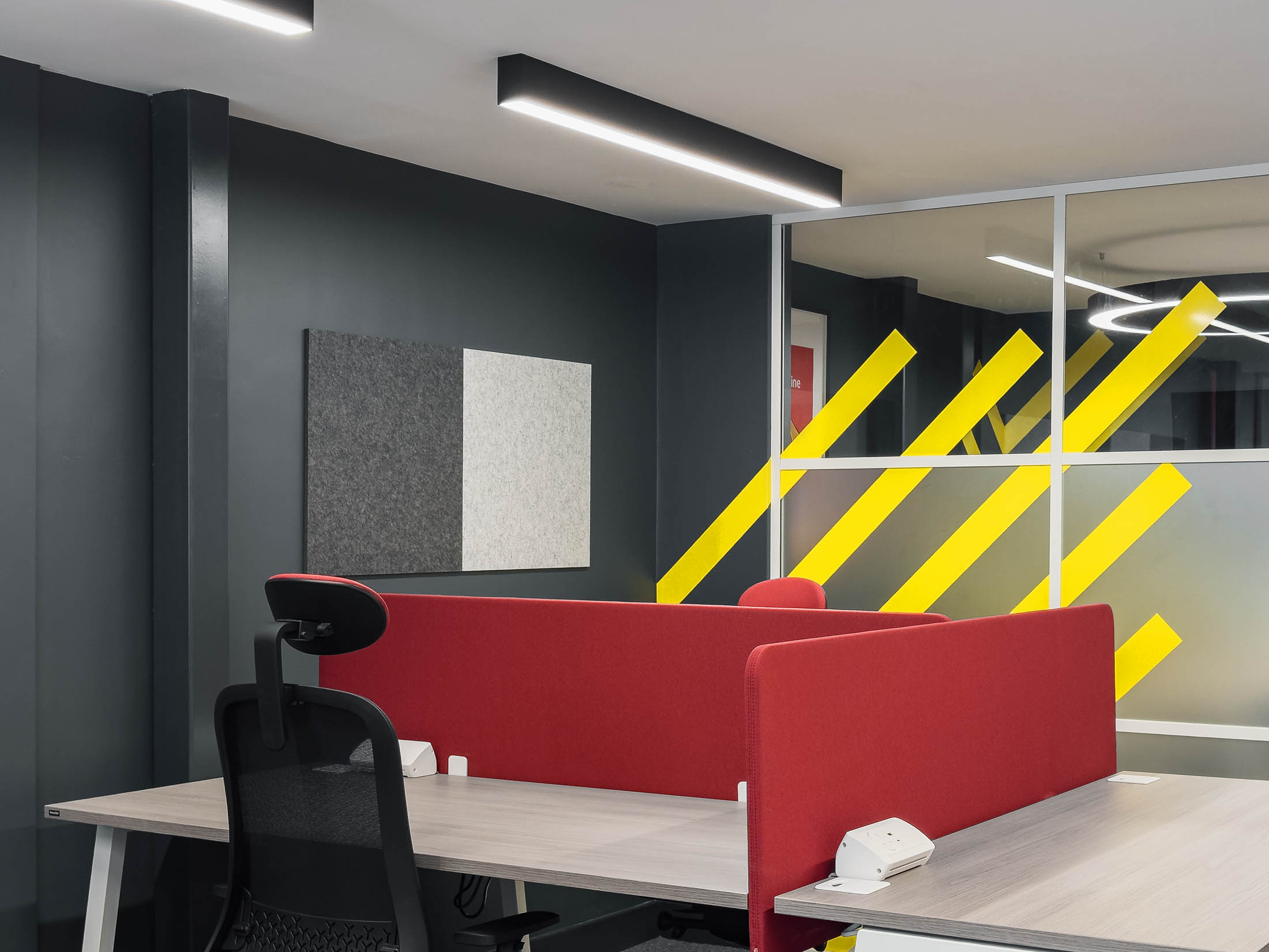 Colour-drenched interior of the refurbished executive box